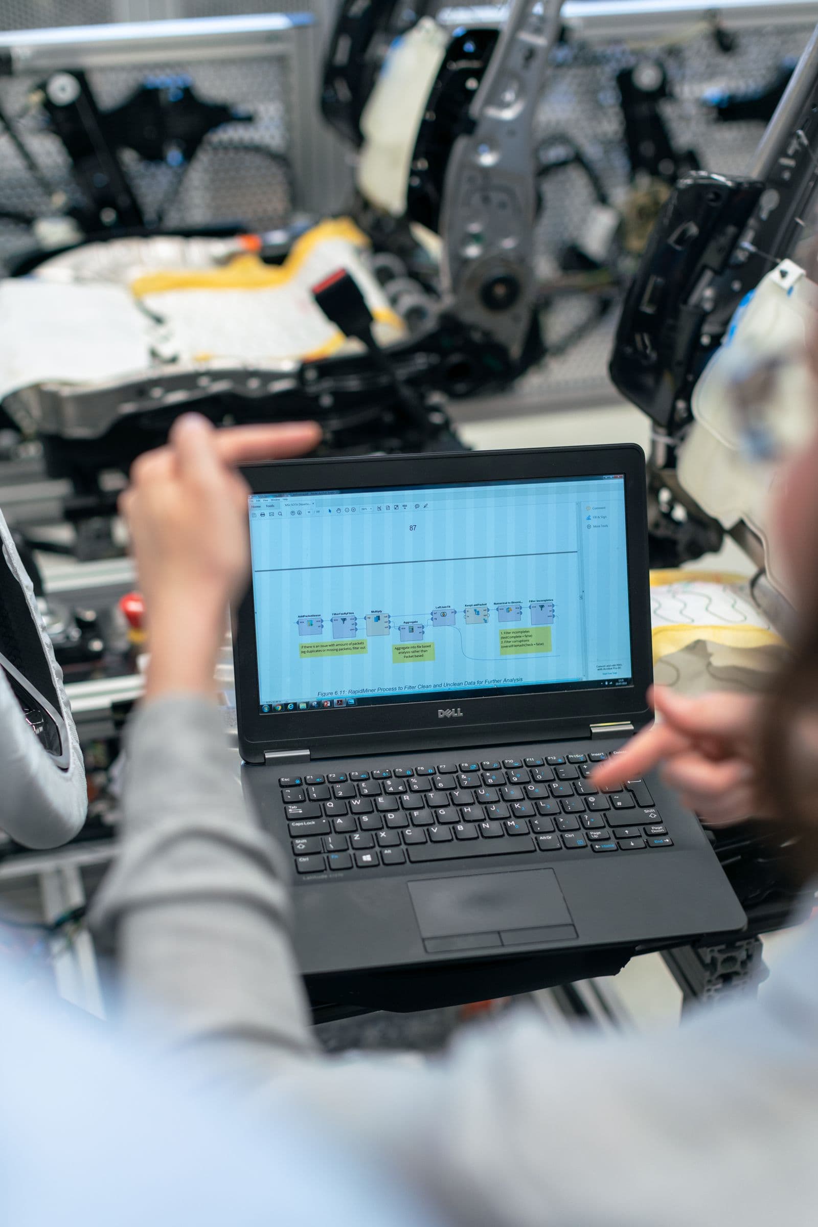 Engineer reviewing aerospace component costs with should-cost software